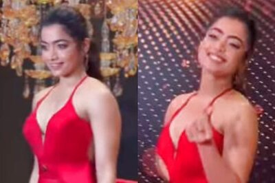 Rashmika Mandanna Looks Drop Dead Gorgeous In Red Dress; Winks at Paps While Posing At Event