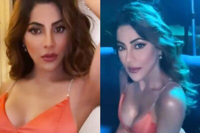 Nikki Tamboli Breaks the Internet in Orange Dress Featuring Plunging Neckline