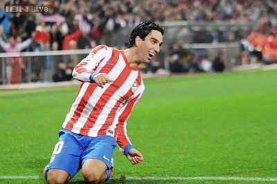 Atletico Madrid tie midfielder Arda Turan until 2017