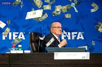 Watch: Protester showers FIFA chief Sepp Blatter with fake money