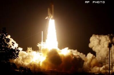 NASA launches space shuttle Discovery after much delay