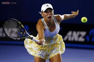 Wozniacki overcomes McHale in surreal encounter in Melbourne