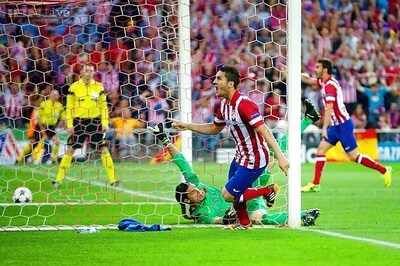 Koke's goal sends Atletico to Champions League semis at Barca's expense