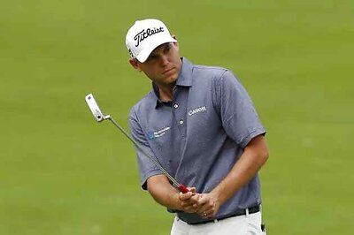 Bill Haas takes Memorial lead, Woods labours to 74