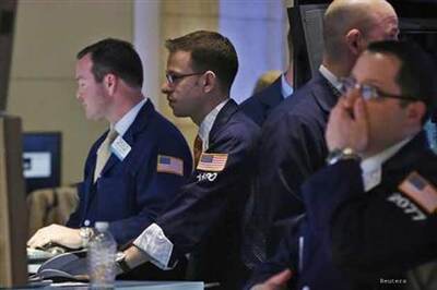Wall Street sinks on commodities selloff, Boston blasts