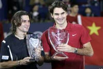 Federer blasts Ferrer to win fourth Masters Cup