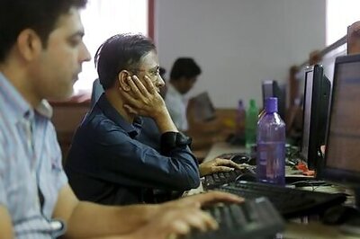 Sensex, Nifty settle higher after RBI keeps rate steady