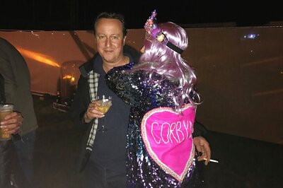 Former UK PM David Cameron's Hug With Woman in Corbyn Glitter Cape Goes Viral