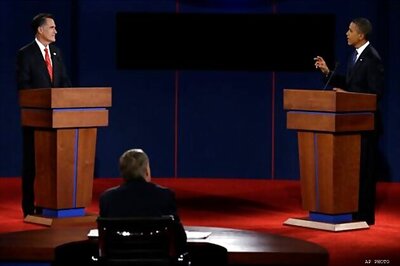 Romney defends tax cuts, Obama says they won't help