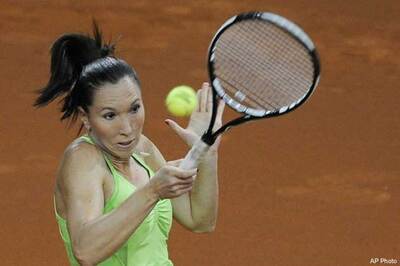 Henin overcomes Jankovic at Porsche GP