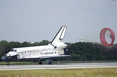 Discovery returns after fixing space loo, installing lab