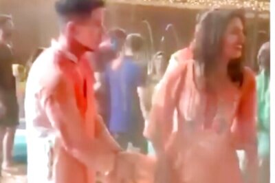 Nick Jonas Mistakes Priyanka Chopra's Dress for a Towel at Holi Bash