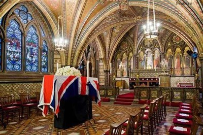 Thatcher's body lies in chapel as funeral debate rages