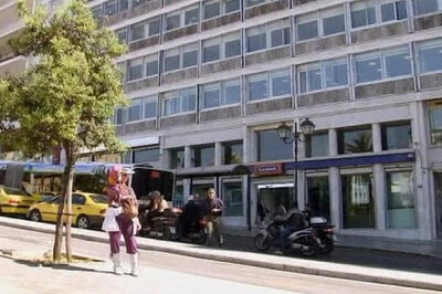 Greece readies austerity measures, markets steady