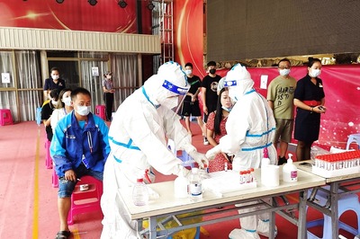 China Detects First Case of Omicron Variant Amid Outbreak of New Delta Strain