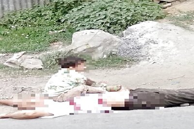 In Heart-wrenching Pics, 3-yr-old Cries Inconsolably on Grandfather's Body After J&K Terror Attack