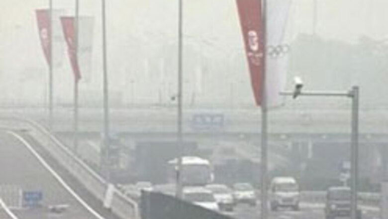 Beijing relieved as haze clears before Olympics