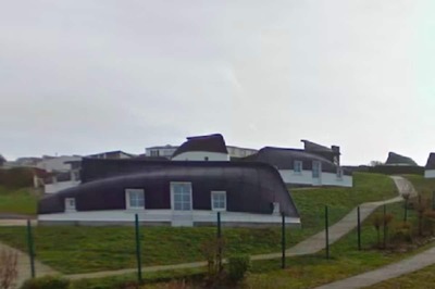 French Village Of Équihen-Plage 'Makes Waves' With Upside-Down Boat Houses