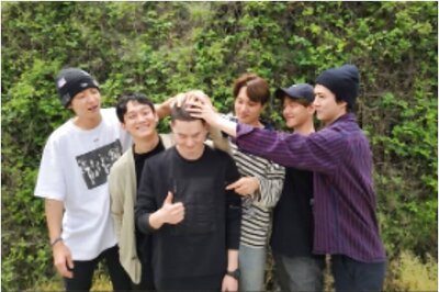 EXO Members Pay Heartfelt Tribute to Suho as He Enlists in Military Service