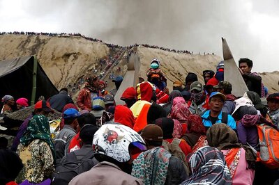 Thousands Climb Indonesia Volcano to Throw Ritual Offerings Into Smoking Crater