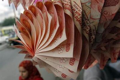 Rupee near two-month low, closes at 62.54 against US dollar