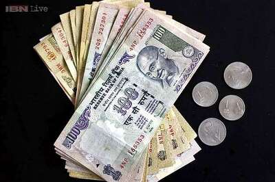 Rupee down 18 paise, opens at 61.12 vs US dollar