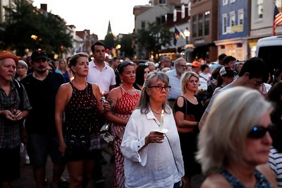 Grief in Small Town: March Honours Victims of Newsroom Attack