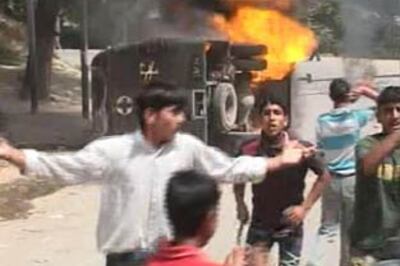 Kashmir still on the boil, mob torches CRPF vehicle