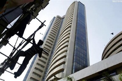Volatile Sensex ekes out margin gain to end at new peak at 26,442.81