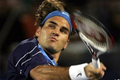 Records fall as Federer marches on